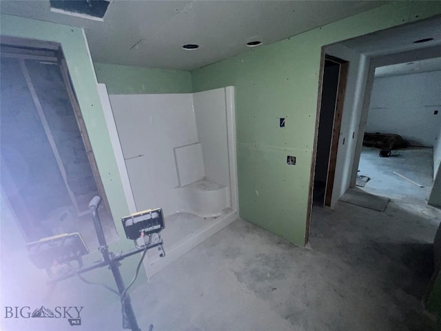 bathroom with unfinished concrete floors