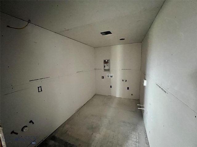 unfurnished room featuring concrete floors