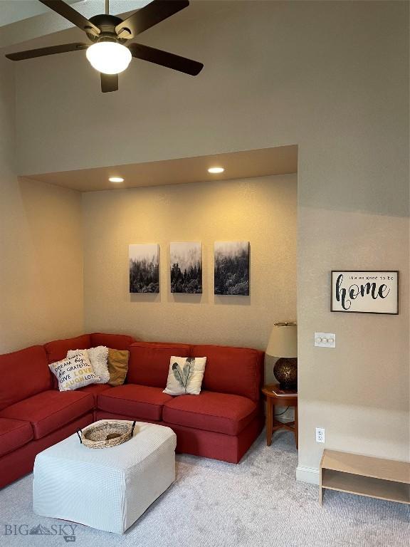 93 8th St Unit B, Belgrade, MT 59714 - carpeted living area with recessed lighting, a ceiling fan, and a high ceiling