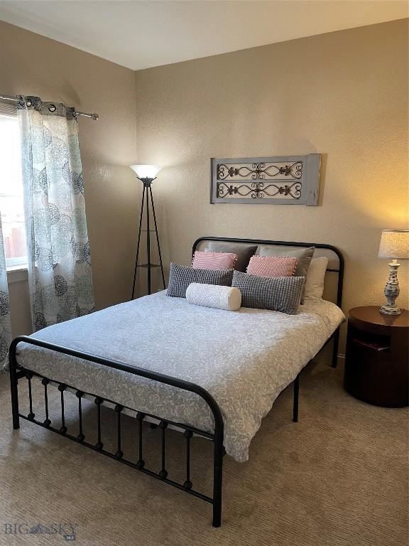 93 8th St Unit B, Belgrade, MT 59714 - bedroom featuring carpet flooring