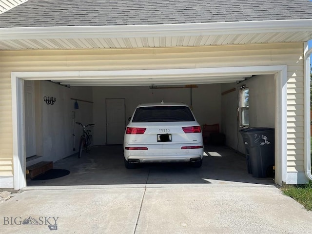 93 8th St Unit B, Belgrade, MT 59714 - garage with driveway