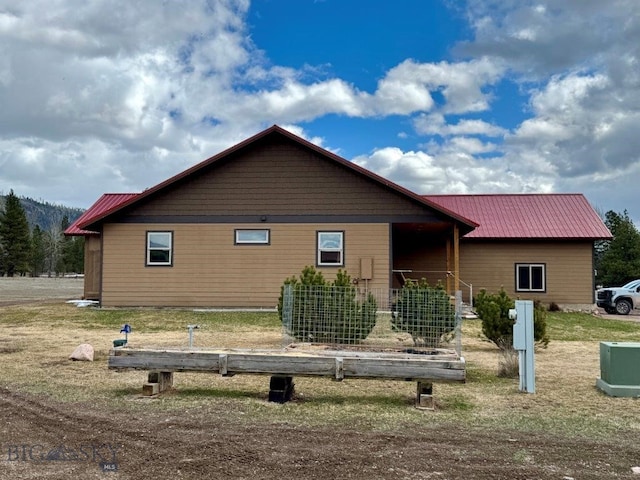 exterior space with metal roof