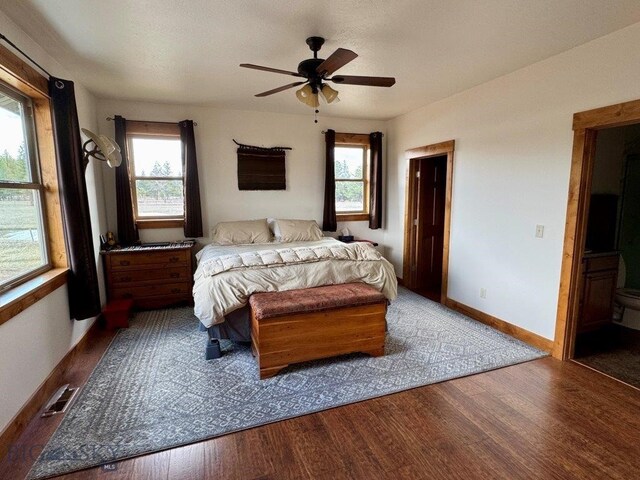 7510 Woodworth Rd, Ovando, MT 59854 - bedroom with wood finished floors, baseboards, and ceiling fan