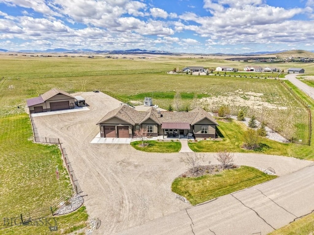 birds eye view of property featuring a rural view
