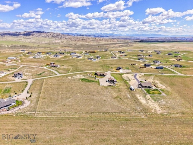 drone / aerial view with a mountain view and a rural view