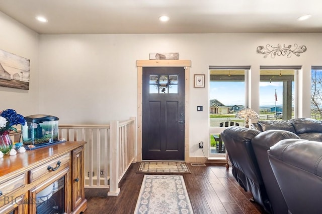 entrance foyer with recessed lighting and dark wood finished floors