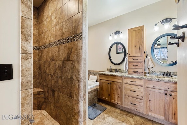 full bathroom with double vanity, a walk in shower, a sink, and a garden tub