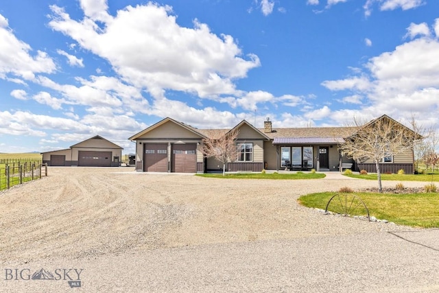 ranch-style house featuring fence, driveway, a chimney, and a garage