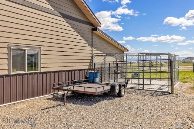 view of side of property featuring fence