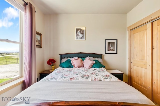 bedroom featuring multiple windows