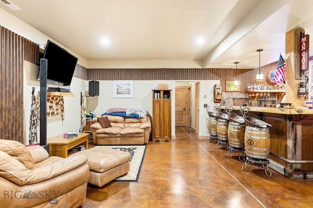 living area with visible vents and concrete flooring