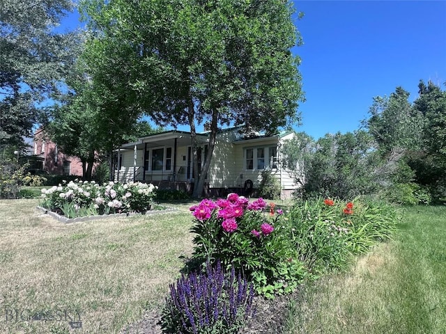 5 1st St W, Whitehall, MT 59759 - view of grassy yard with a porch