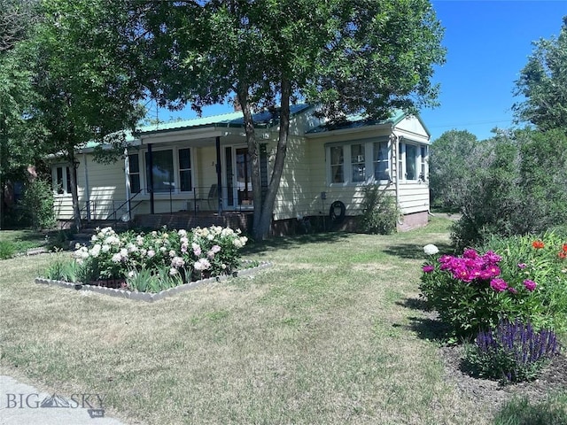 5 1st St W, Whitehall, MT 59759 - ranch-style house featuring a porch and a front yard