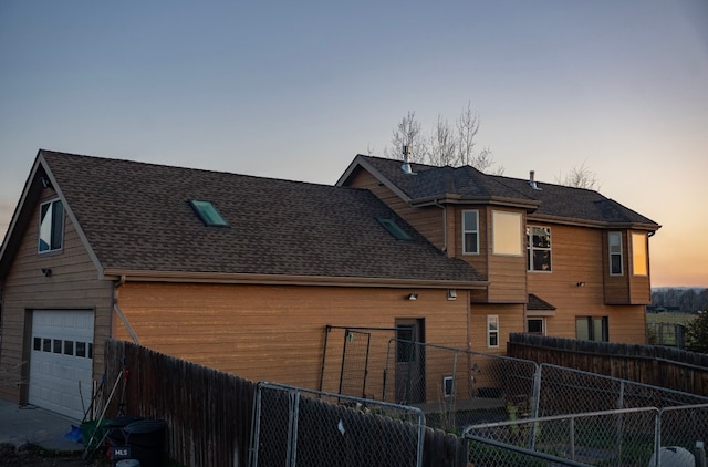 8265 Fowler Ln, Bozeman, MT 59718 - property exterior at dusk featuring roof with shingles