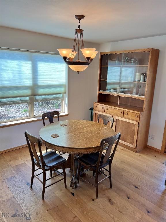 8265 Fowler Ln, Bozeman, MT 59718 - dining space featuring light wood-style flooring and baseboards