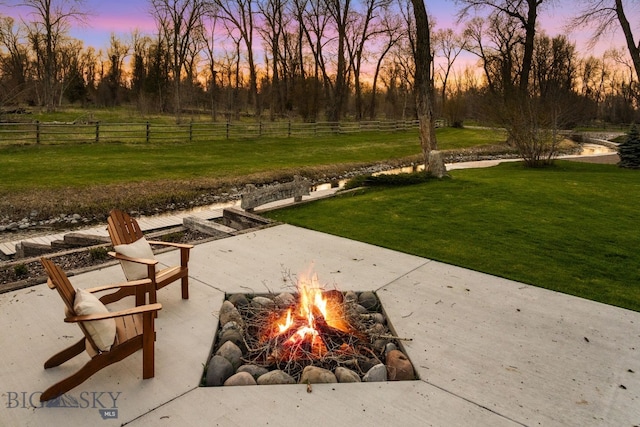624 Rocking Horse Dr, Bozeman, MT 59718 - view of home's community featuring a lawn, fence, and an outdoor fire pit