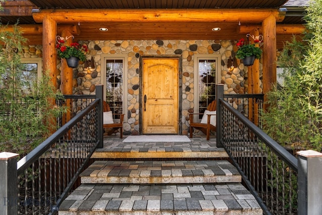 624 Rocking Horse Dr, Bozeman, MT 59718 - doorway to property with stone siding