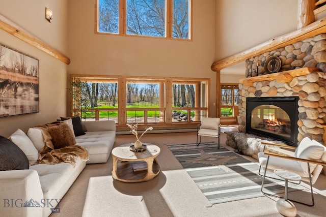 624 Rocking Horse Dr, Bozeman, MT 59718 - carpeted living area with a stone fireplace and a towering ceiling