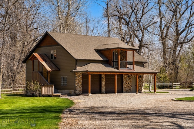 624 Rocking Horse Dr, Bozeman, MT 59718 - rustic home featuring fence, a shingled roof, stone siding, and gravel driveway