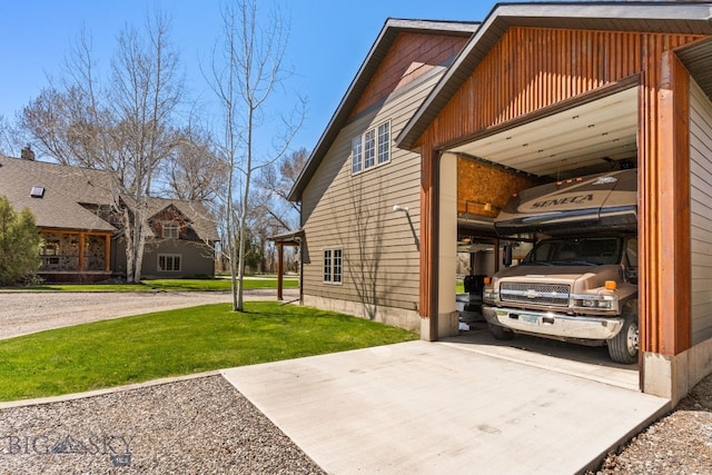 624 Rocking Horse Dr, Bozeman, MT 59718 - view of home's exterior with a lawn and concrete driveway