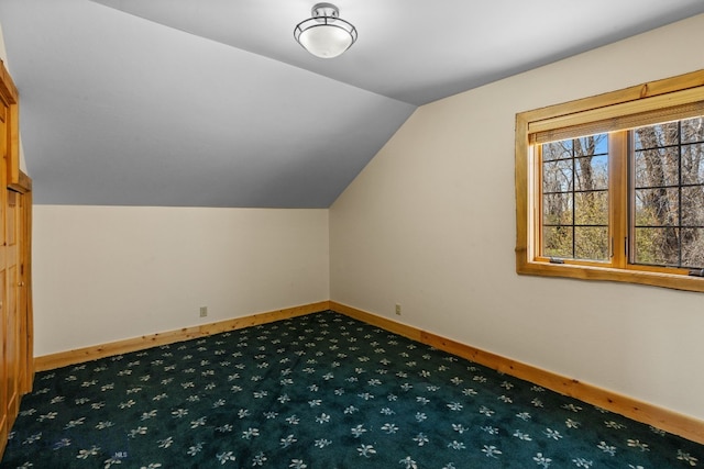 624 Rocking Horse Dr, Bozeman, MT 59718 - bonus room featuring baseboards, carpet, and lofted ceiling
