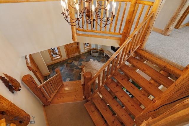 624 Rocking Horse Dr, Bozeman, MT 59718 - stairway featuring an inviting chandelier and carpet