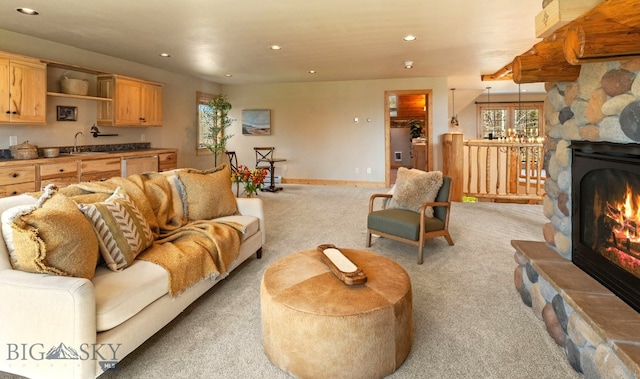 624 Rocking Horse Dr, Bozeman, MT 59718 - living area featuring recessed lighting, baseboards, a stone fireplace, and light carpet