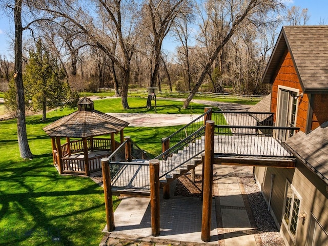 624 Rocking Horse Dr, Bozeman, MT 59718 - exterior space featuring a gazebo, a lawn, a wooden deck, and stairs
