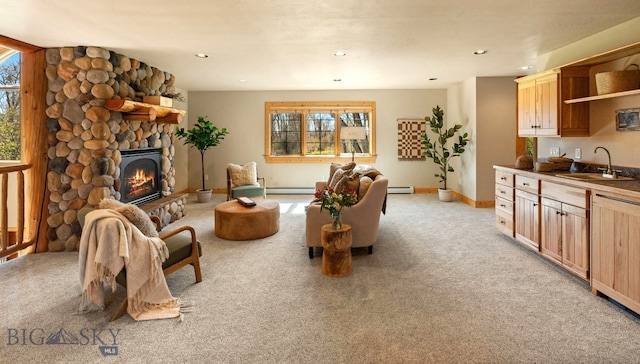 624 Rocking Horse Dr, Bozeman, MT 59718 - living room with baseboards, a baseboard radiator, a fireplace, and light colored carpet