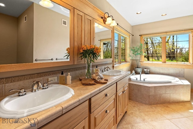 624 Rocking Horse Dr, Bozeman, MT 59718 - full bathroom featuring a bath, visible vents, a sink, and tile patterned flooring