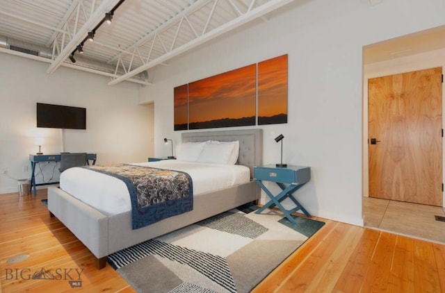 bedroom with hardwood / wood-style flooring