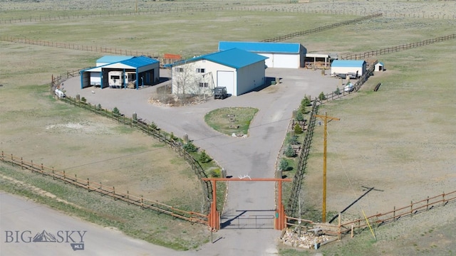 birds eye view of property with a rural view