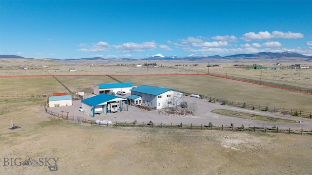 aerial view with a mountain view and a rural view