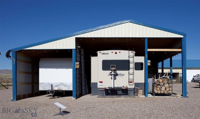 view of outbuilding with a carport