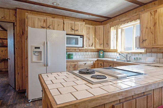 kitchen featuring light brown cabinets, white appliances, dark wood-type flooring, tile countertops, and tasteful backsplash