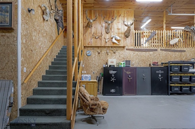 stairway featuring concrete floors