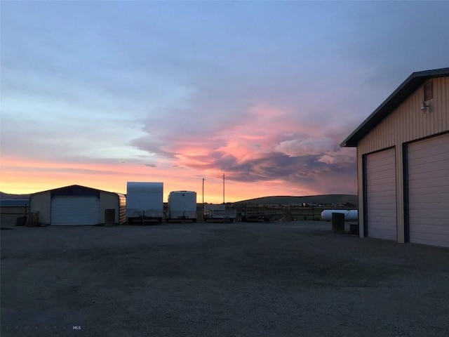 10 Dons Ln, Dillon, MT 59725 - view of garage at dusk