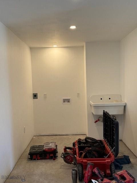 washroom with hookup for an electric dryer