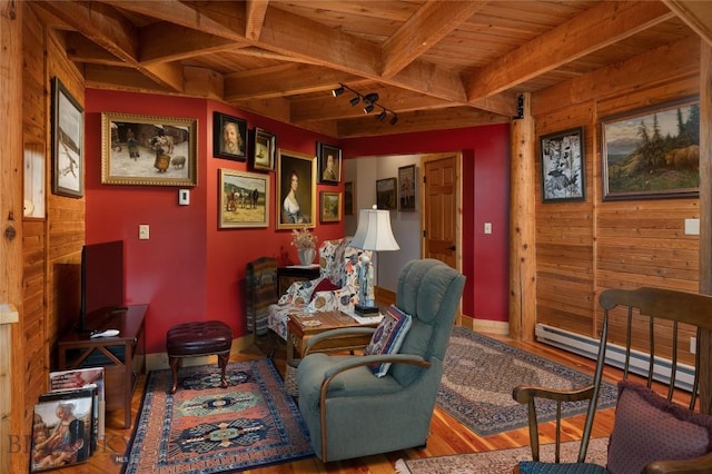189 Quinn Creek Rd, Bozeman, MT 59715 - sitting room featuring a baseboard radiator, beam ceiling, wood ceiling, and wood finished floors