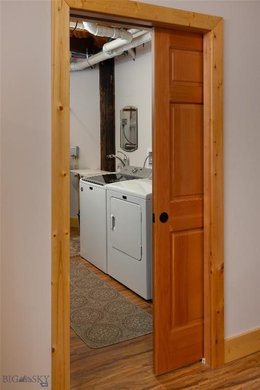 189 Quinn Creek Rd, Bozeman, MT 59715 - clothes washing area featuring separate washer and dryer, laundry area, and light wood-style flooring