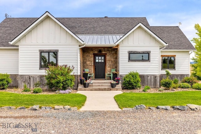 14549 High Flat Rd, Bozeman, MT 59718 - modern farmhouse style home featuring a standing seam roof, roof with shingles, board and batten siding, a metal roof, and a front lawn