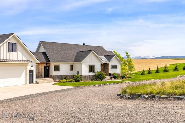 14549 High Flat Rd, Bozeman, MT 59718 - modern farmhouse style home featuring board and batten siding, concrete driveway, and a shingled roof