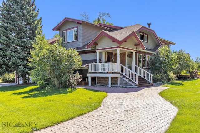 381 Bozeman Trail Rd, Bozeman, MT 59715 - view of front of house with covered porch, a shingled roof, and a front yard