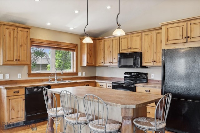 381 Bozeman Trail Rd, Bozeman, MT 59715 - kitchen with a sink, a breakfast bar, black appliances, vaulted ceiling, and a kitchen island