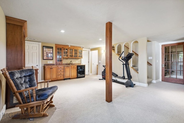 381 Bozeman Trail Rd, Bozeman, MT 59715 - workout room with indoor wet bar, baseboards, wine cooler, light colored carpet, and recessed lighting