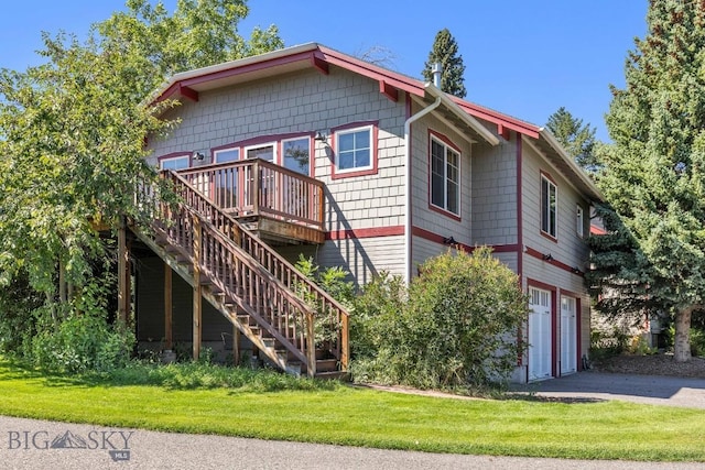 381 Bozeman Trail Rd, Bozeman, MT 59715 - back of house with aphalt driveway, stairs, a garage, a wooden deck, and a lawn