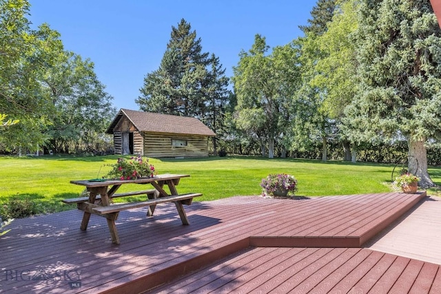 381 Bozeman Trail Rd, Bozeman, MT 59715 - wooden deck featuring an outbuilding and a lawn