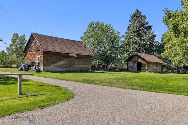 381 Bozeman Trail Rd, Bozeman, MT 59715 - view of home's exterior with a lawn, an outbuilding, and a barn