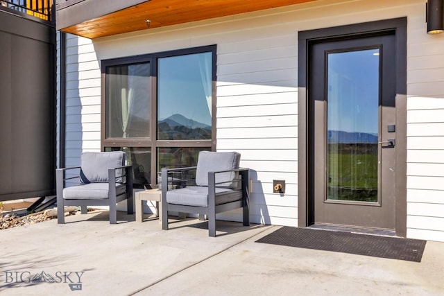view of patio / terrace featuring a mountain view