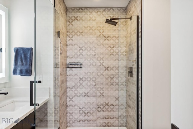 bathroom featuring vanity and a shower stall